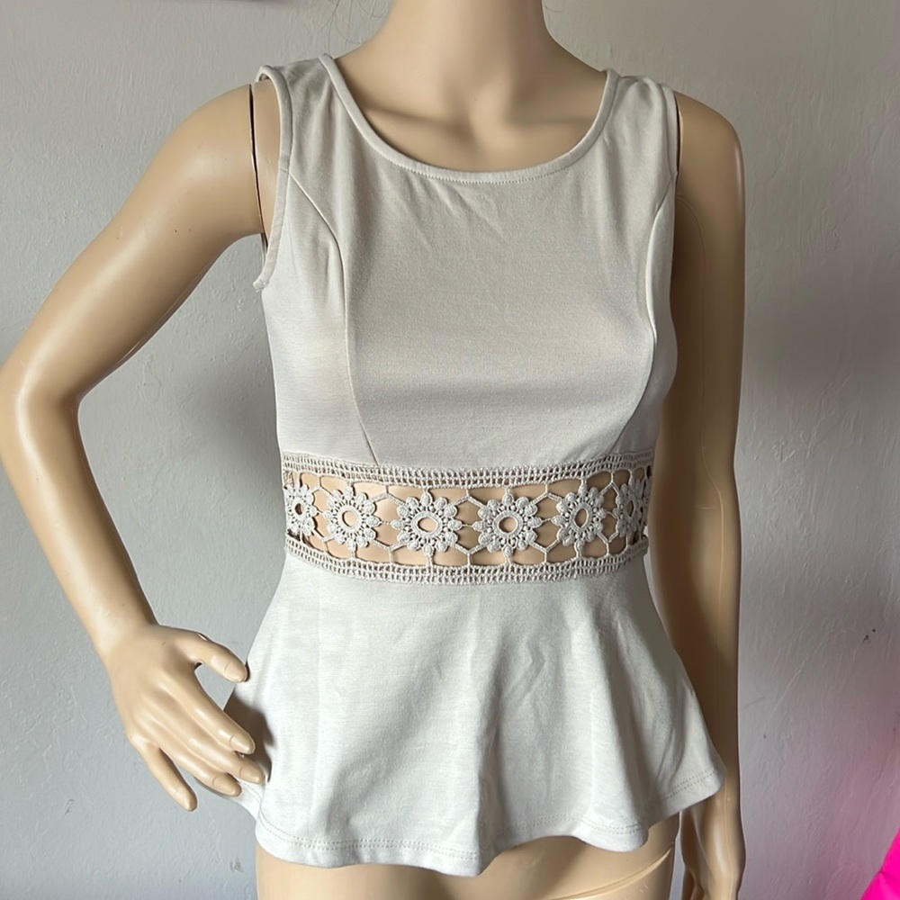 Beige crochet cut out peplum top. Size S